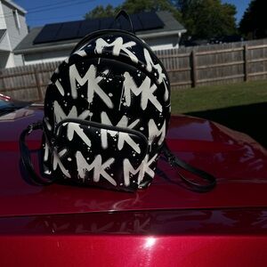 Two Michael Kors backpacks very good condition. Original tags with both bags!